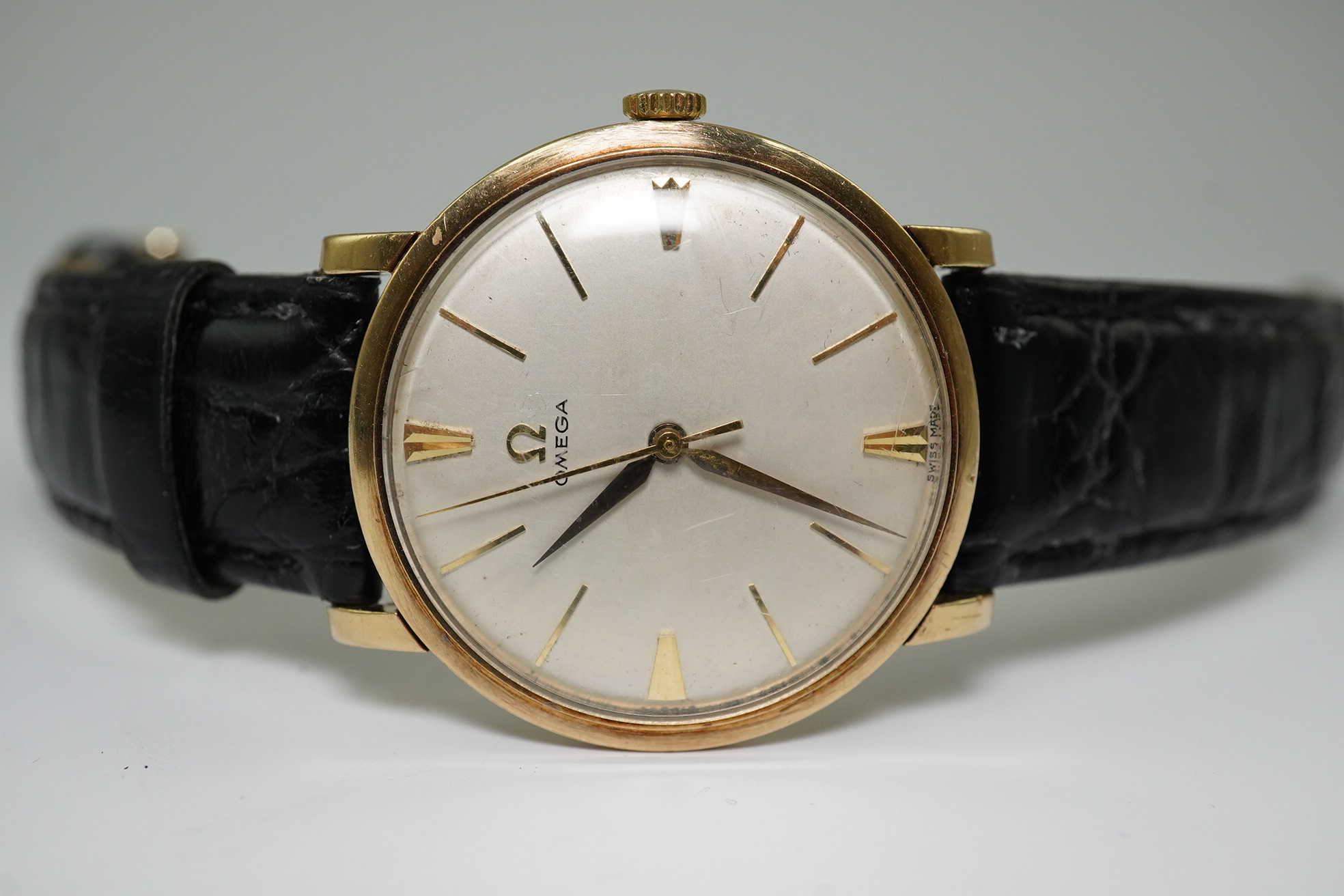 A gentleman's late 1950's 9ct gold Omega manual wind wrist watch